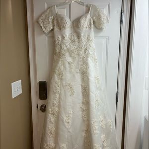 White formal gown with train. Or wedding dress with train.
